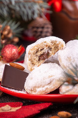 Traditional Christmas cookies biscuits snowballs covered icing sugar povder with almond nut, nutella chocolate an raspberry jam. Christmas New Year ornament decorations.