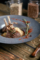 Rack of lamb with polenta. Low key, copyspace, rustic style