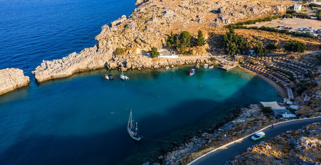 view from the drone on the rocky shore by the sea. Rhodes Greece Lindos Bay.