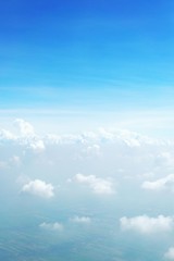 blue sky background with clouds, beautiful cloudscape, view over white fluffy clouds, freedom concept
