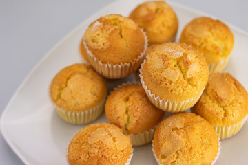 Lots of freshly baked and golden muffins ready for breakfast