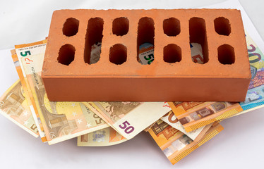 Brick on fifty and twenty euros bills