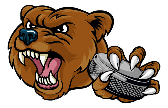 A bear ice hockey player animal sports mascot holding a hockey puck