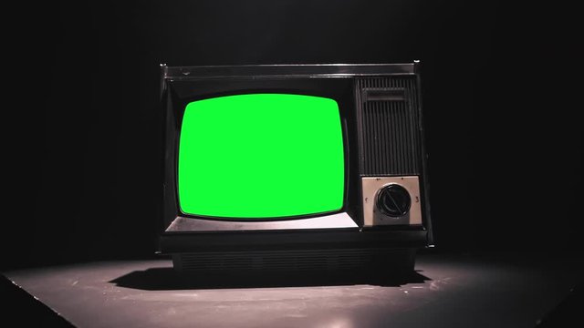 Vintage Tv Television Green Screen. Zooming into green screen of an old television vintage style 4k