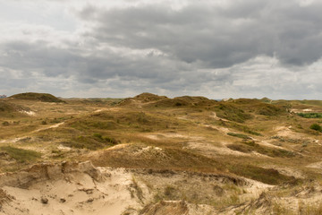 High point of view dune landscape with gray cloudy sky