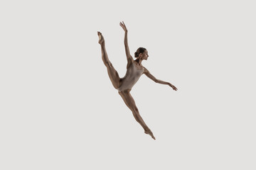 Modern ballet dancer. Contemporary art ballet. Young flexible athletic woman.. Studio shot isolated on white background. Negative space. - obrazy, fototapety, plakaty