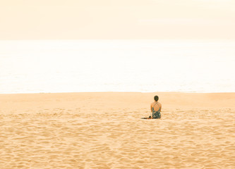 Fototapeta na wymiar Woman traveler doing sit on tropical beach in vacation.