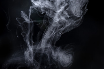 Abstract  powder or smoke isolated on black background