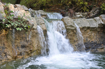 Fototapeta premium НA small waterfall in the Zhane River Valley. Krasnodar region, Russia