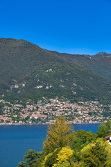 Fototapeta na wymiar Panoramic view of Lake Como. Lombardy, Italy. Autumn season. Perfect clear blue sky.