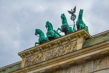 Obraz premium Wide-angle view of Berlin skyline with famous TV tower at Alexanderplatz and dramatic cloudscape in beautiful twilight during blue hour at dusk in summer, central Berlin Mitte, Germany