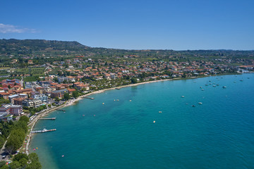 Aerial photography. Beautiful coastline. In the city of Bardolino, Lake Garda is the north of Italy. View by Drone.
