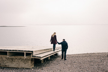 couple in love walks on the pier