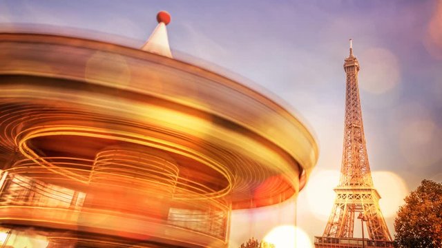 Vintage carousel and Eiffel tower at night, blurred bokeh holiday lights, Paris France. 3D animation, seamless loop, video 4K