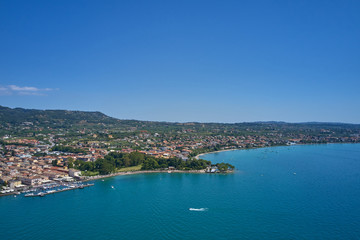 Naklejka na ściany i meble Aerial photography. Beautiful coastline. In the city of Bardolino, Lake Garda is the north of Italy. View by Drone.