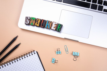 Stalker, word made from colorful wooden alphabet letters