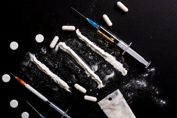 Hard drugs on dark table
