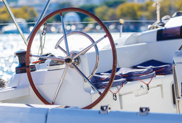 A modern speed boat yacht steering wheels. Background.