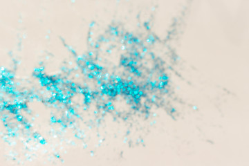 Light blue bokeh glitter sparcles on white background. Design pattern
