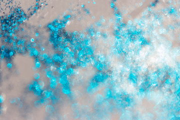 Light blue bokeh glitter sparcles on white background. Design pattern