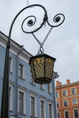 Fototapeta na wymiar Lantern on a bridge in the historic center of the St. Petersburg, Russia