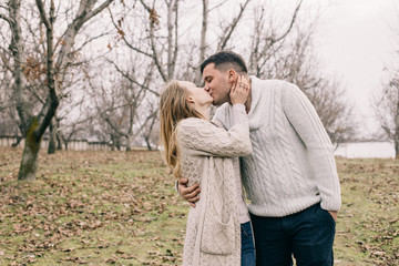 couple in love walks and cuddles in nature