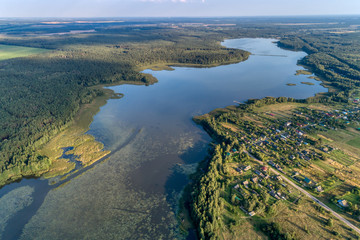 Beautiful aerial shot of a large forest lake.