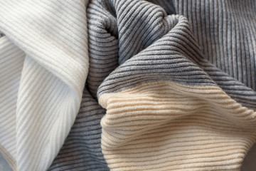 Warm knitted woolen takan pastel shades background.