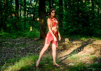 Female spirit mythology. Wild woman in forest. Sexy girl early stage in the evolutionary...