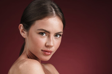 Image of charming half-naked woman posing and looking at camera