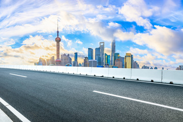 Fototapeta na wymiar City skyline and asphalt road in Shanghai