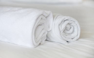 Fototapeta na wymiar Two towels on the bed in hotel room