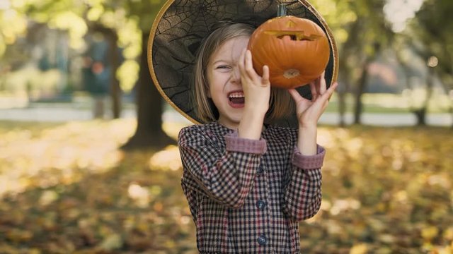 Spooky face with small pumpkins