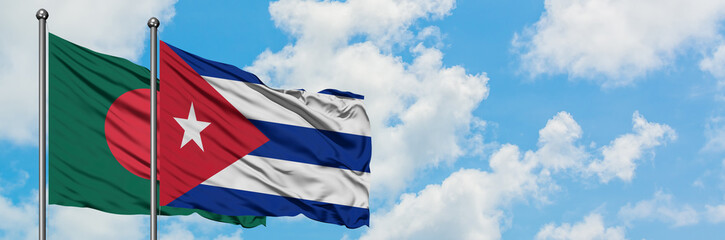 Bangladesh and Cuba flag waving in the wind against white cloudy blue sky together. Diplomacy concept, international relations.