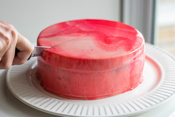 Cherry Chocolate Birthday Cheesecake on plate with knife, very delicious.