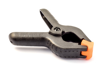 Black plastic clamp isolated on white background