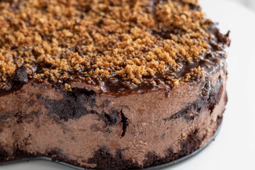 Chocolate nut mousse Cake decorated with crushed nuts.