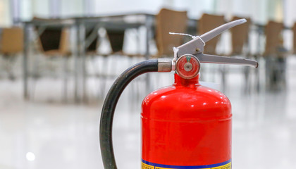 Red fire extinguishers available in fire emergencies,safety concept.