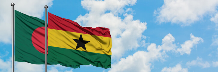 Bangladesh and Ghana flag waving in the wind against white cloudy blue sky together. Diplomacy concept, international relations.