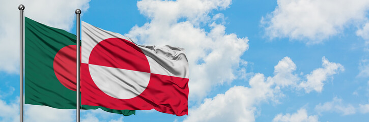 Fototapeta na wymiar Bangladesh and Greenland flag waving in the wind against white cloudy blue sky together. Diplomacy concept, international relations.