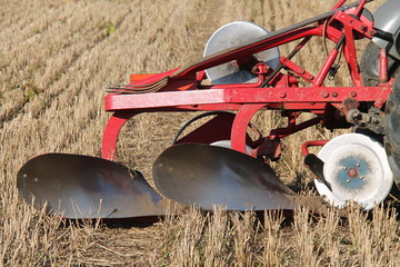 An Old Fashioned Tractor Drawn Vintage Farm Plough.