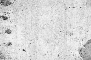 Texture of a concrete wall with cracks and scratches which can be used as a background