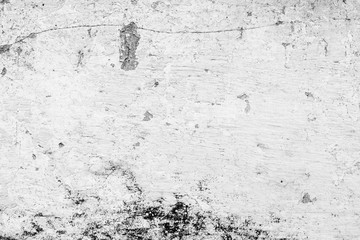 Texture of a concrete wall with cracks and scratches which can be used as a background