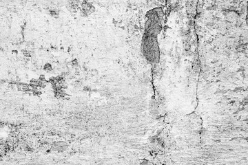 Texture of a concrete wall with cracks and scratches which can be used as a background
