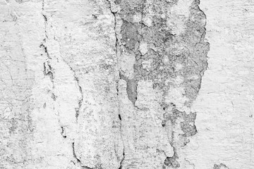 Texture of a concrete wall with cracks and scratches which can be used as a background