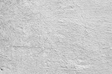 Texture of a concrete wall with cracks and scratches which can be used as a background