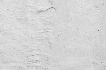 Texture of a concrete wall with cracks and scratches which can be used as a background