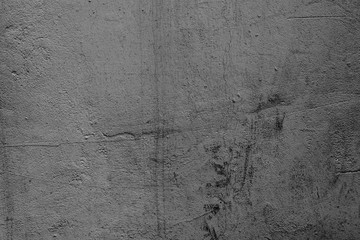 Texture of a concrete wall with cracks and scratches which can be used as a background