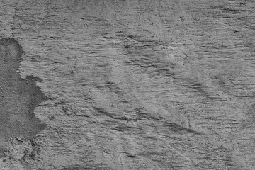 Texture of a concrete wall with cracks and scratches which can be used as a background