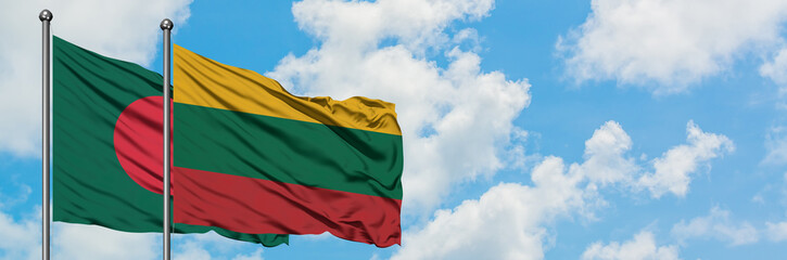 Bangladesh and Lithuania flag waving in the wind against white cloudy blue sky together. Diplomacy concept, international relations.